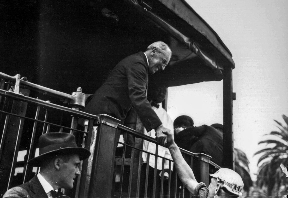 President Woodrow Wilson shakes hands at the Santa Fe station in Los Angeles. 