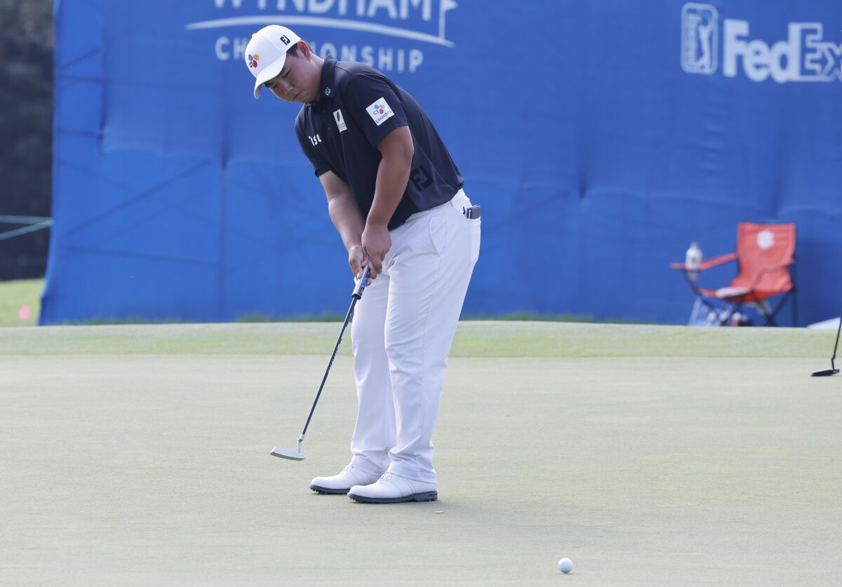 Joohyung Kim from Korea putts on the ninth green during the second round of the Wyndham Championship golf tournament, Friday, Aug. 5, 2022, in Greensboro, N.C. (AP Photo/Reinhold Matay)
