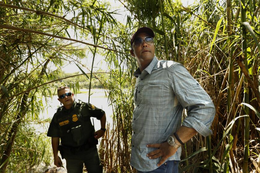 EAGLE PASS, TEXAS--JUNE 3, 2019---On June 3, 2019 Republican Rep. Will Hurd, right, of Texas takes a tour of the Rio Grande River in Eagle Pass with Border Patrol Agent in Charge Bryan Kemmett, left. Republican Rep. Will Hurd of Texas, represents a district with more than 800 miles of U.S.-Mexico border. The lone black Republican in the House whoÕs won a 70% Latino district three times, should be the future of the GOP. Instead, in early August, the rare if reluctant Republican Trump critic announced he would not seek reelection. Hurd represents TexasÕs 23rd which stretches from San Antonio, where he was born and raised, to the stateÕs westernmost corner in El Paso. The district is bigger than some states and overwhelmingly Latino, and thus, Democratic -- ÒA bellwether,Ó he says. ÒLook, Texas is purple. ThereÕs no doubt about that.Ó(Carolyn Cole/Los Angeles Times)