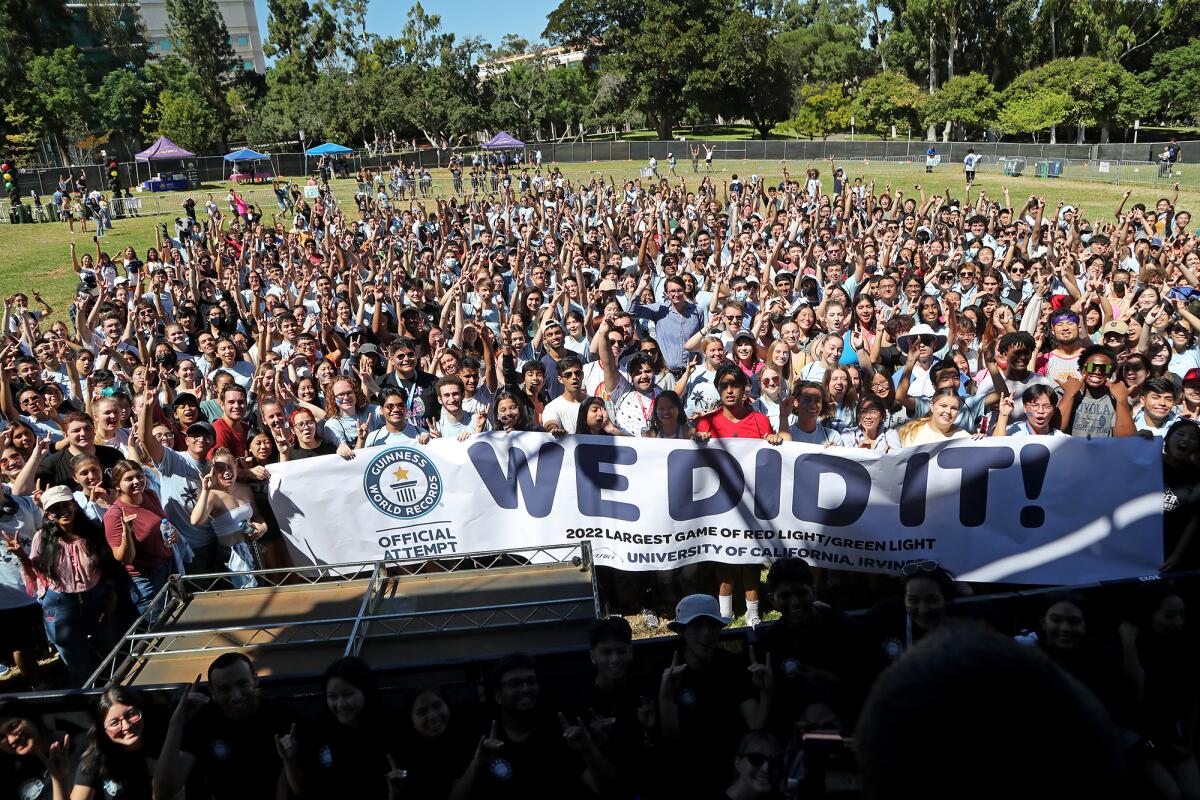 UC Irvine students celebrate as they gather for a group photo.