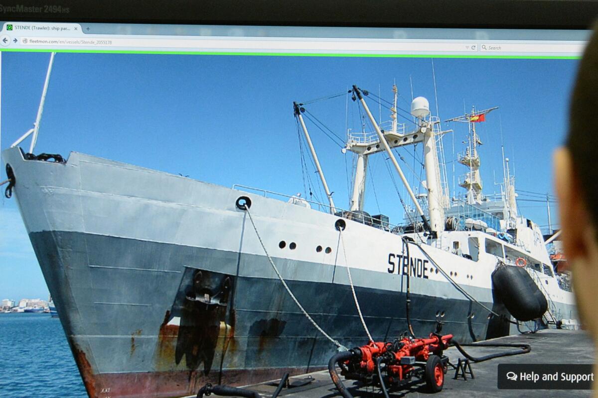 A Moscow man's computer screen displays a photo of a trawler like the Dalny Vostok.