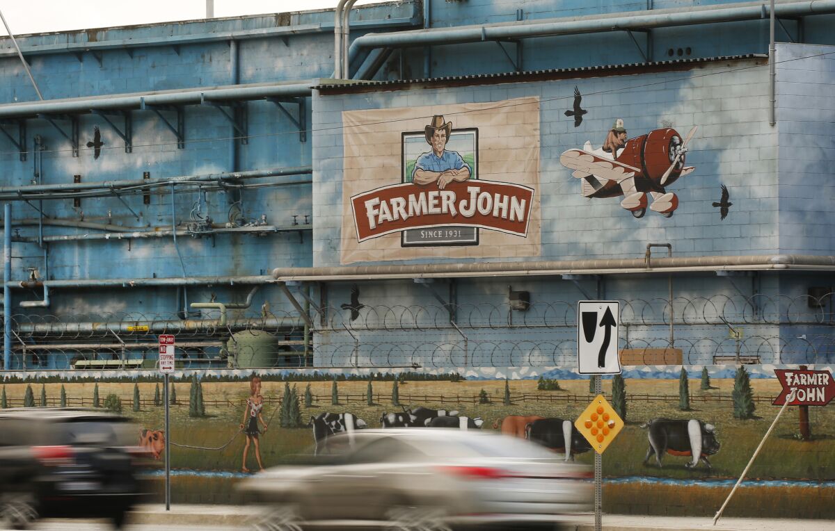 The Farmer John plant, producer of the Dodger Dog, is among the facilities that have reported COVID-19 outbreaks.
