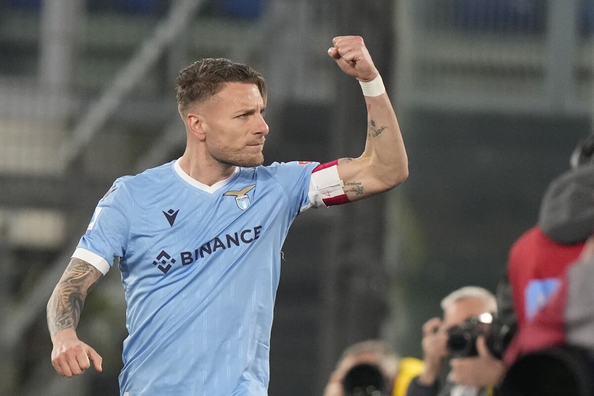 Lazio's Ciro Immobile celebrates after scoring with penalty against Venezia during the Serie A soccer match between Lazio and Venezia, at Rome's Olympic Stadium, in Rome, Italy, Monday, March 14, 2022. (AP Photo/Andrew Medichini)