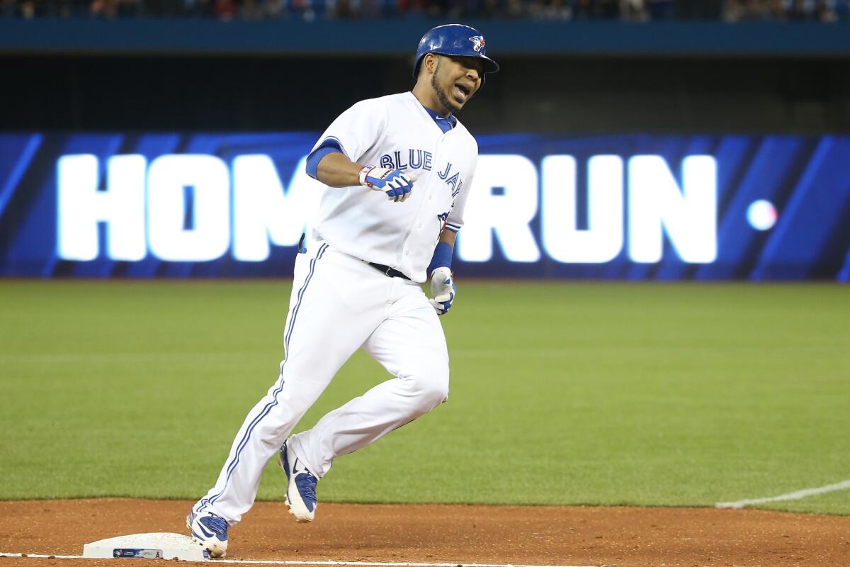 Blue Jays slugger Edwin Encarnacion circles the bases after hitting a three-run homer in the fifth inning against the Angels.