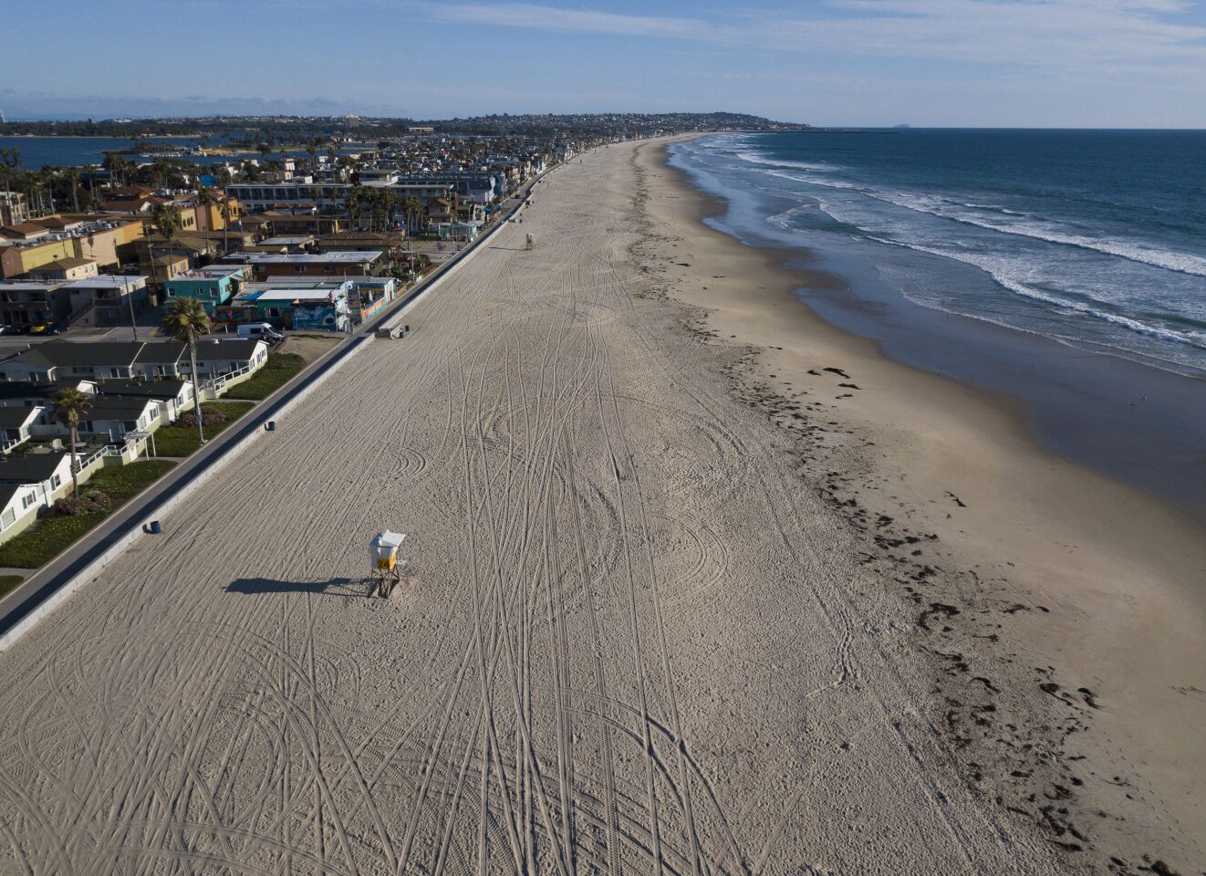 An empty Pacific Beach on March 24, 2020. San Diego City beaches, parks and trails were closed in an attempt to slow down the spread of the coronavirus.