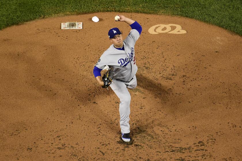 WASHINGTON, DC - OCTOBER 06: Hyun-Jin Ryu #99 of the Los Angeles Dodgers pitches in the first inning against the Washington Nationals in Game 3 of the NLDS at Nationals Park on October 6, 2019 in Washington, DC. (Photo by Patrick McDermott/Getty Images)