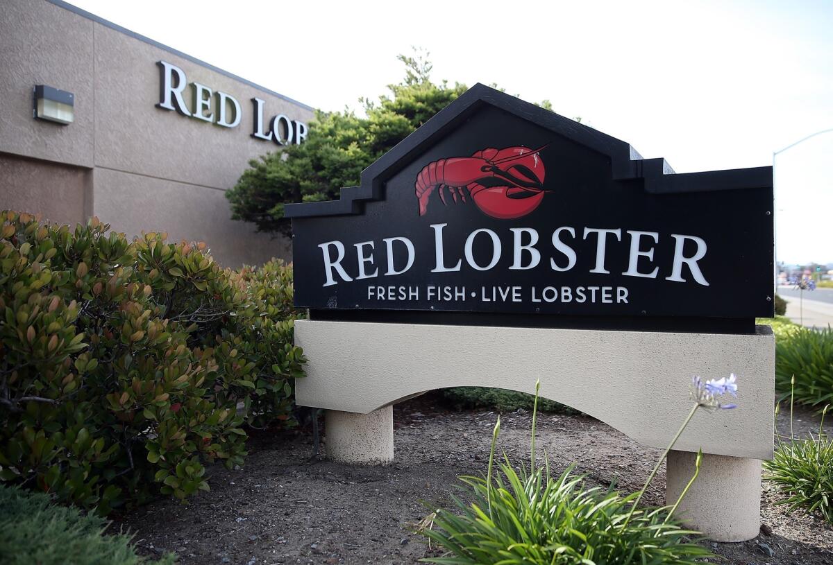 A sign is posted in front of a Red Lobster restaurant on May 16, 2014, in San Bruno, Calif.