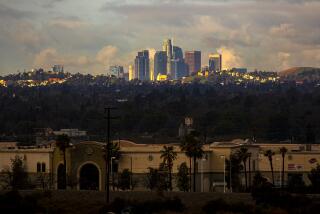 Irwindale, CA - March 10: A view of downtown Los Angeles skyline after morning rain from 605 freewaay on Wednesday, March 10, 2021 in Irwindale, CA.(Irfan Khan / Los Angeles Times)