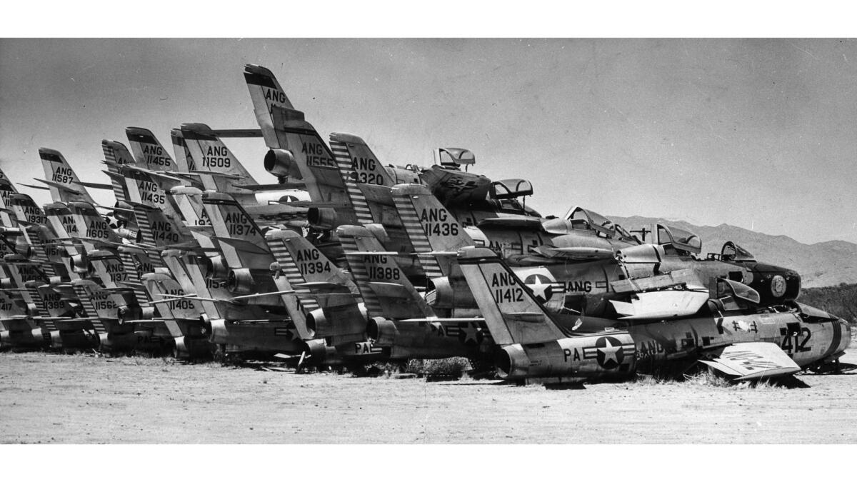 March 1960: F-84 Thunderjets are stacked awaiting demolition at Davis-Monthan Air Force Base in Tucson. This photo appeared in the Los Angeles Times on March 6, 1960.