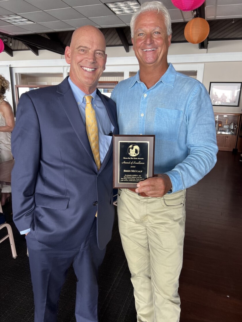 Coldwell Banker Realty La Jolla branch manager Jeff Nunn (left) congratulates Brien Metcalf on his Award of Excellence.