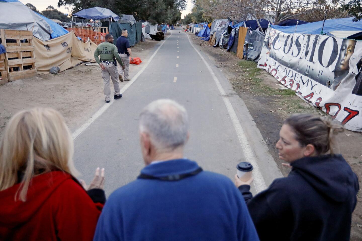 Judge visits homeless encampment