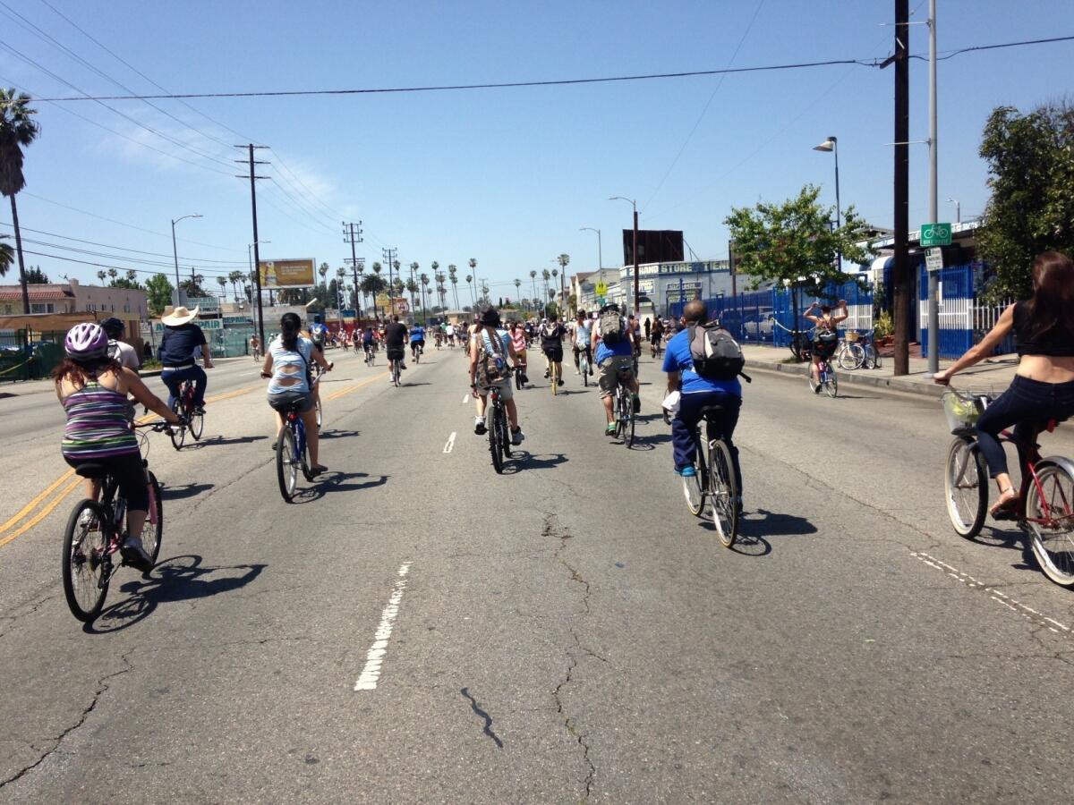 Cyclists make their way down Venice Boulevard on Sunday.