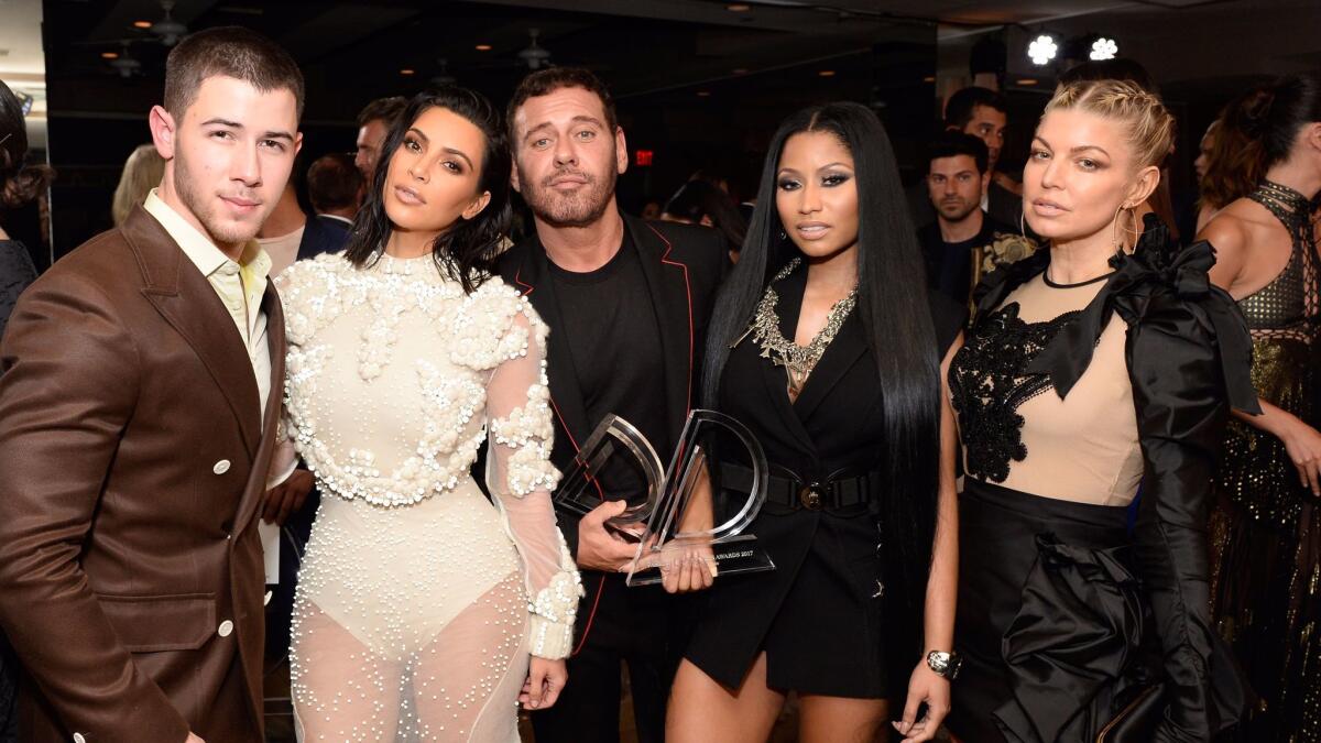Appearing at the Daily Front Row's 3rd annual Fashion Los Angeles Awards, from left, event host Nick Jonas with Kim Kardashian West, Mert Alas, Nicki Minaj and Fergie at Sunset Tower Hotel in West Hollywood on Sunday.