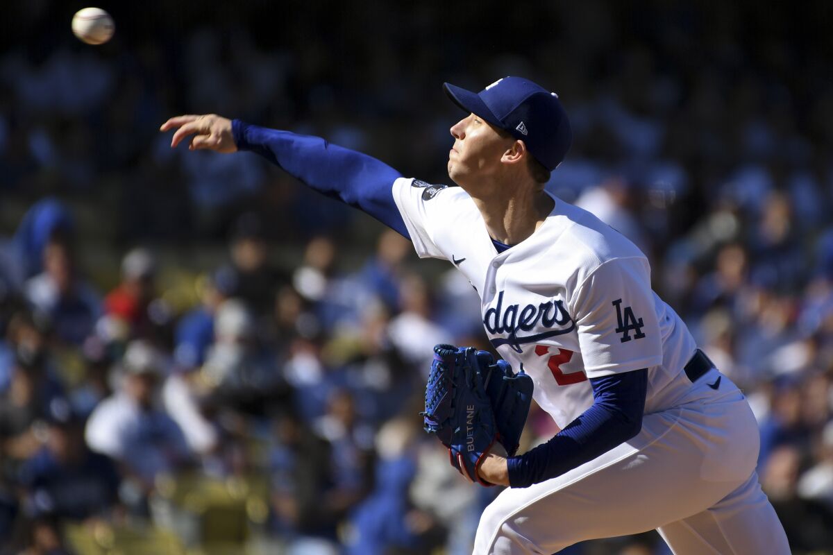Dodgers starting pitcher Walker Buehler delivers a pitch during the first inning.