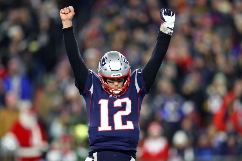 FOXBOROUGH, MASSACHUSETTS - DECEMBER 21: Tom Brady #12 of the New England Patriots celebrates after Rex Burkhead #34 scored a touchdown against the Buffalo Bills in the fourth quarter at Gillette Stadium on December 21, 2019 in Foxborough, Massachusetts. The Patriots defeat the Bills 24-17. (Photo by Maddie Meyer/Getty Images)