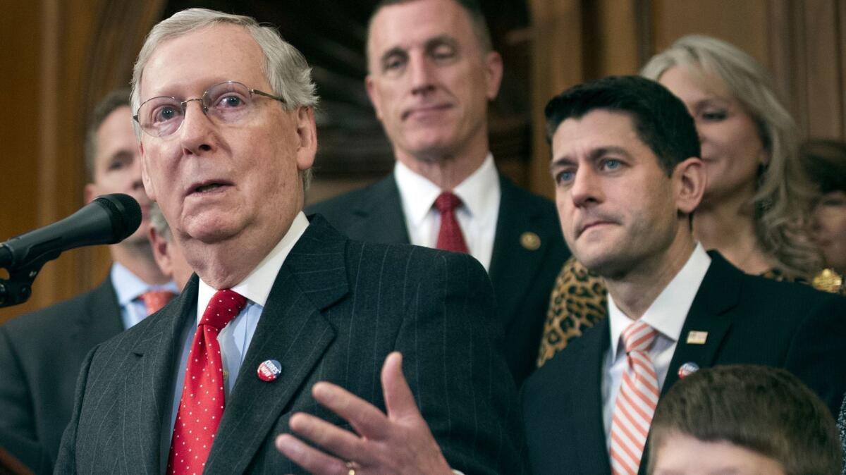 Senate Majority Leader Mitch McConnell (R-Ky.) speaks to reporters. With him are Rep. Tim Murphy (R-Pa.), background, and House Speaker Paul D. Ryan (R-Wis.), right.