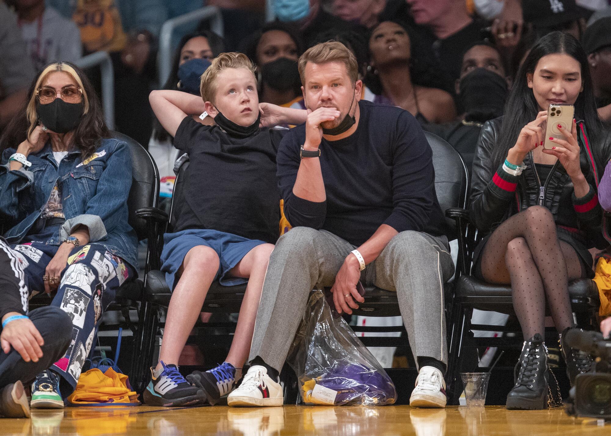 James Corden and his son, Max Corden, watch the Lakers.