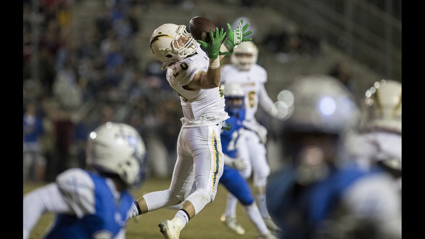 Edison's Hunter Griggs makes a one-handed catch during a first round CIF Southern Section Division 2 playoff game against La Habra on Friday, November 10.