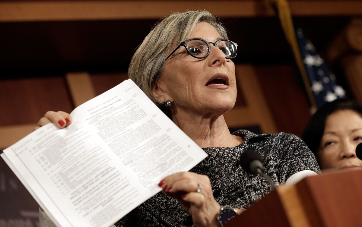 Democratic Sen. Barbara Boxer, shown at a news conference last month, called Republicans "sore losers," shutting the government down because of their "dislike of this president and his signature accomplishment."