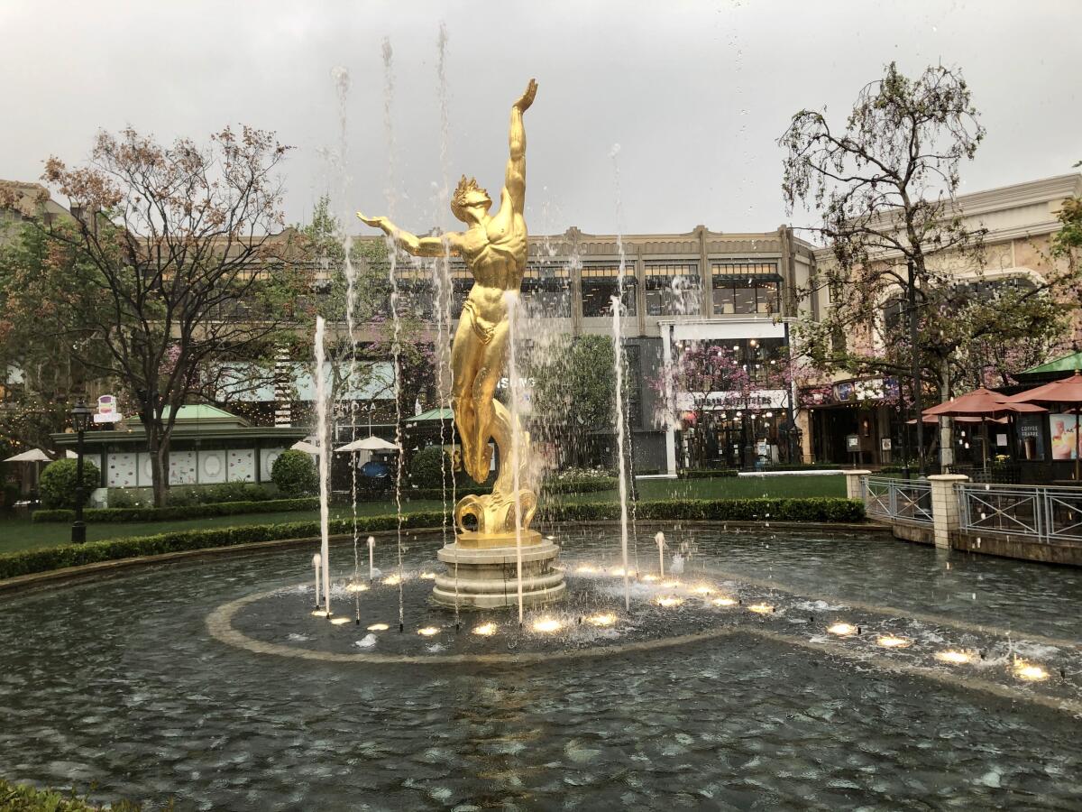 Most stores in the Americana at Brand are closed due to the novel coronavirus, but the outdoor mall's fountain continues to dance to timeless classics.