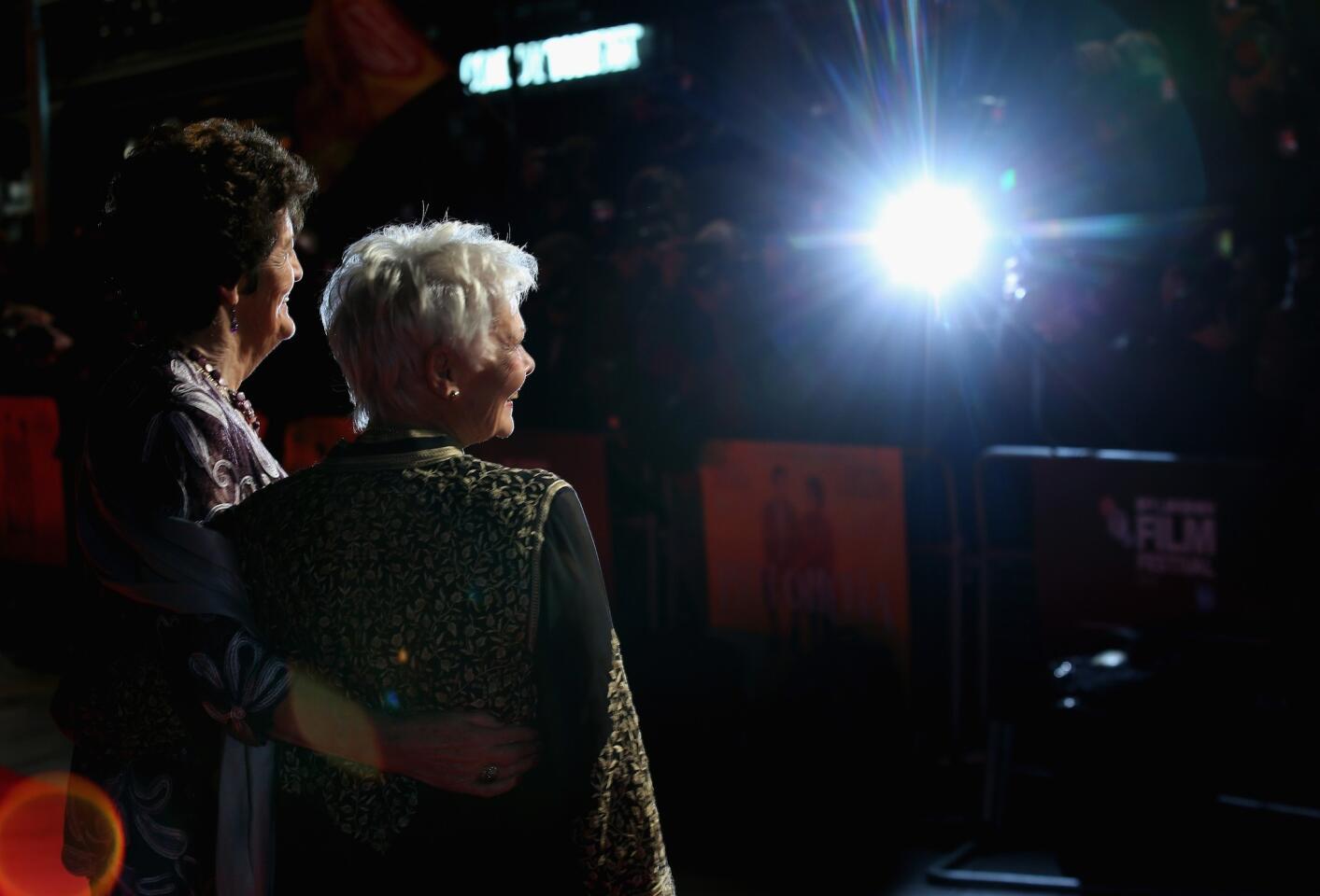 Actress Dame Judi Dench, right, and Philomena Lee attend the "Philomena" American Express Gala screening during the 57th BFI London Film Festival at Odeon Leicester Square on Oct. 16, 2013, in London.