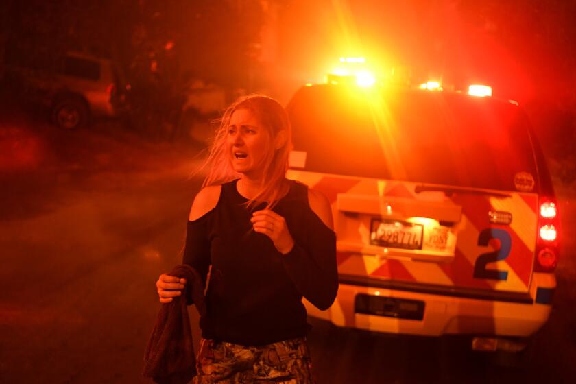 LA CONCHITA, CALIFORNIA DECEMBER 7, 2017-A scared and confused resident can't find her ride as the Thomas Fire approaches the town of La Conchita early Thursday morning. (Wally Skalij/Los Angeles Times)