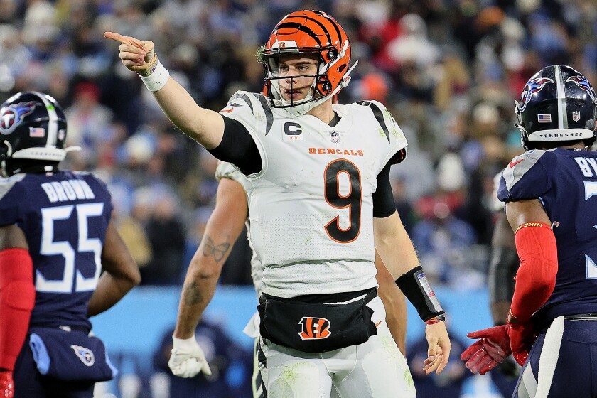 QB Joe Burrow, celebrating after rushing for a first down, has the Cincinnati Bengals in AFC title game.
