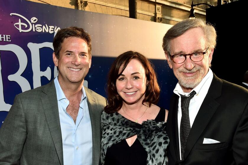 HOLLYWOOD, CA - JUNE 21: (L-R) CEO, Amblin Partners, Michael Wright, Executive producer Kristie Macosko Krieger and Director Steven Spielberg arrive on the red carpet for the US premiere of Disney's "The BFG," directed and produced by Steven Spielberg. A giant sized crowd lined the streets of Hollywood Boulevard to see stars arrive at the El Capitan Theatre. "The BFG" opens in U.S. theaters on July 1, 2016, the year that marks the 100th anniversary of Dahl's birth, at the El Capitan Theatre on June 21, 2016 in Hollywood, California. (Photo by Alberto E. Rodriguez/Getty Images for Disney) ** OUTS - ELSENT, FPG, CM - OUTS * NM, PH, VA if sourced by CT, LA or MoD **