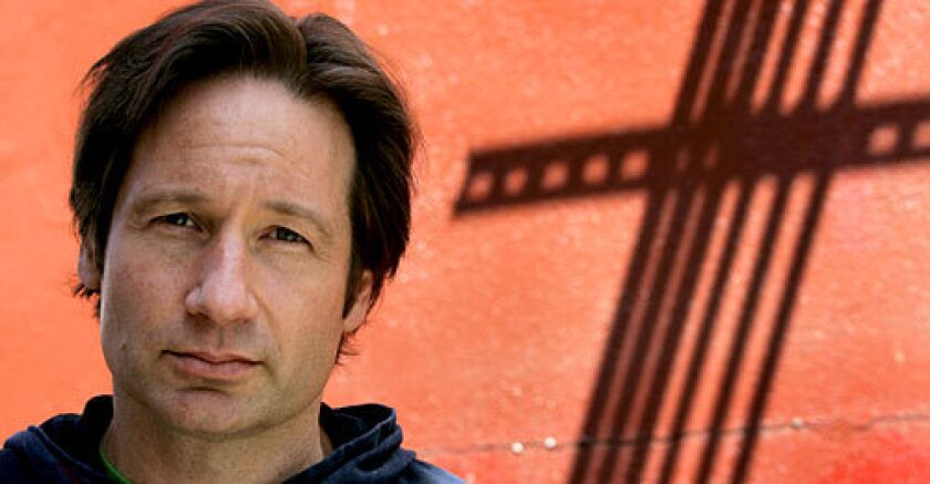 THE TRUTH IS OUT THERE: Of the movies plot, Duchovny, in true FBI style, says: You can ask, but my job is to not answer.