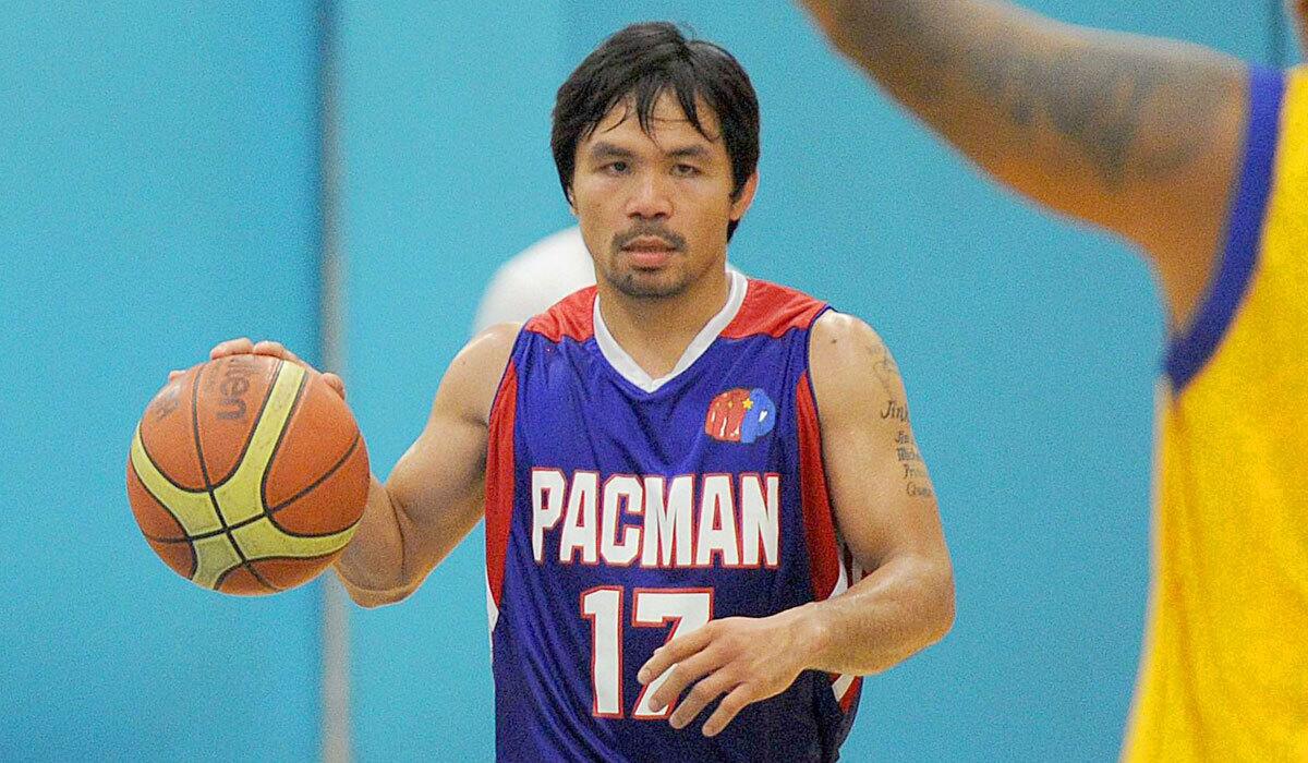 Manny Pacquiao takes part in practice with the Kia Motors team of the Philippine Basketball Assn. in Manila on Aug. 15.