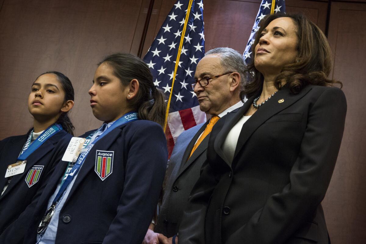 Fatima, left, and Yuleni Avelica, with Senate Majority Leader Chuck Schumer (D-N.Y) and Sen. Kamala Harris (D-Calif.) during a news conference on Capitol Hill.