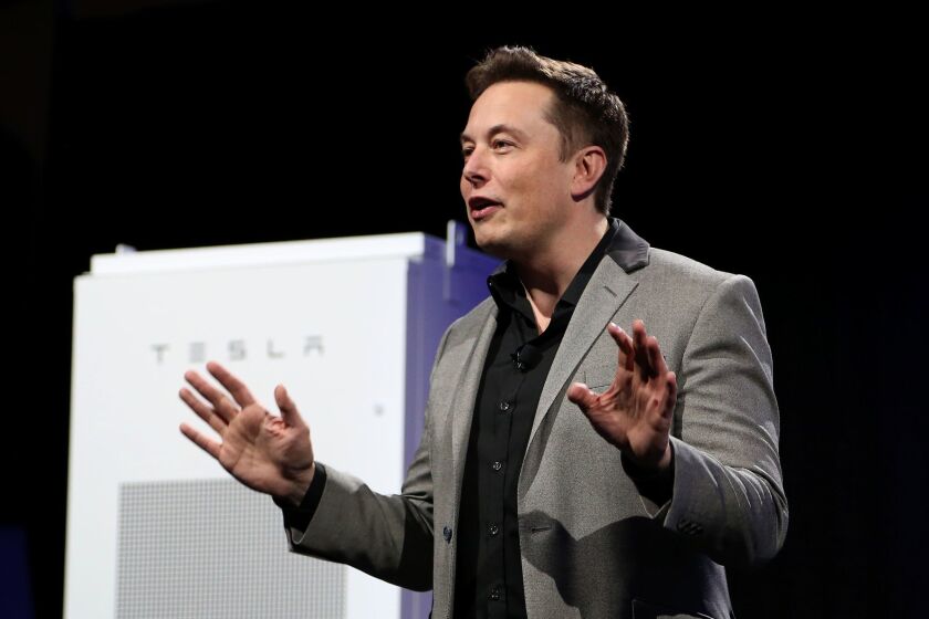 Tesla Chief Executive Elon Musk unveils large utility-scale batteries at the Tesla Design Studio in Hawthorne in 2015.
