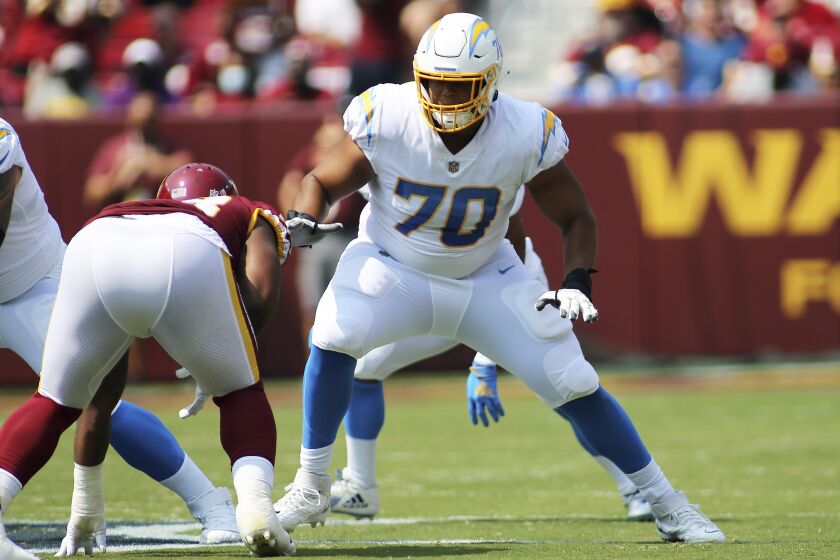 Los Angeles Chargers offensive tackle Rashawn Slater (70) blocks during an NFL football game against the Washington Football Team, Sunday, Sept. 12, 2021 in Landover, Md. (AP Photo/Daniel Kucin Jr.)