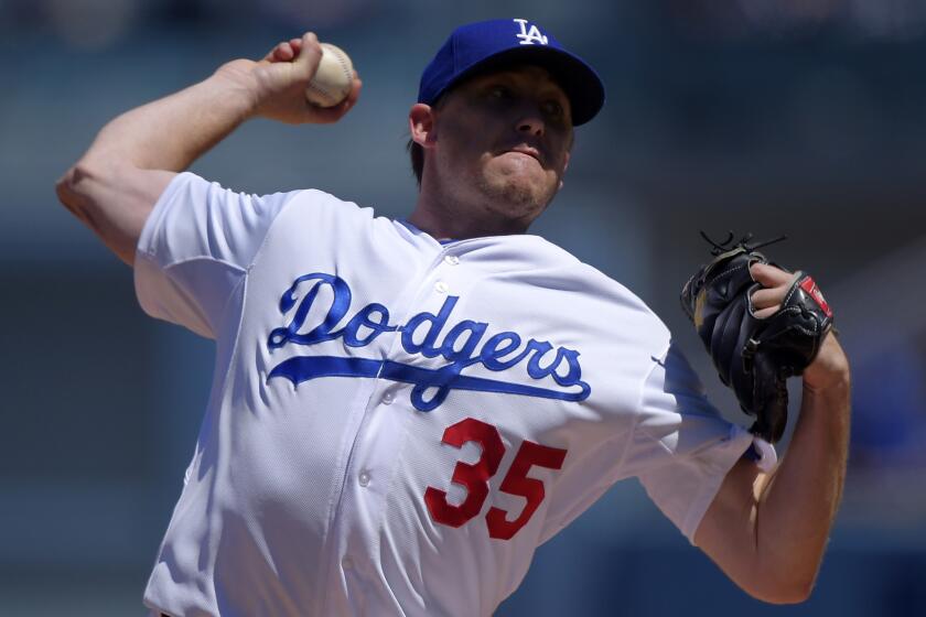 Dodgers starter Kevin Correia delivers a pitch during the first inning of an 11-3 loss to the New York Mets on Sunday.