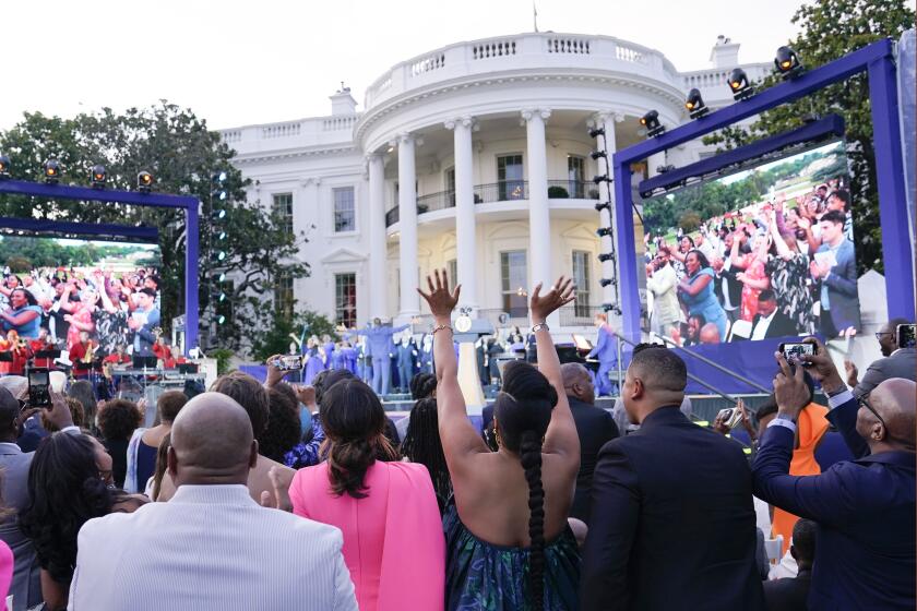 FILE - Guests respond as Broadway Inspirational Voices performs during a Juneteenth concert on the South Lawn of the White House in Washington, June 13, 2023. Biden will celebrate the Juneteenth holiday early with a concert on the White House South Lawn on Monday night. Singers Gladys Knight and Patti LaBelle will be among the performers. Biden signed a law in 2021 that made June 19, or Juneteenth, a federal holiday. (AP Photo/Susan Walsh, File)
