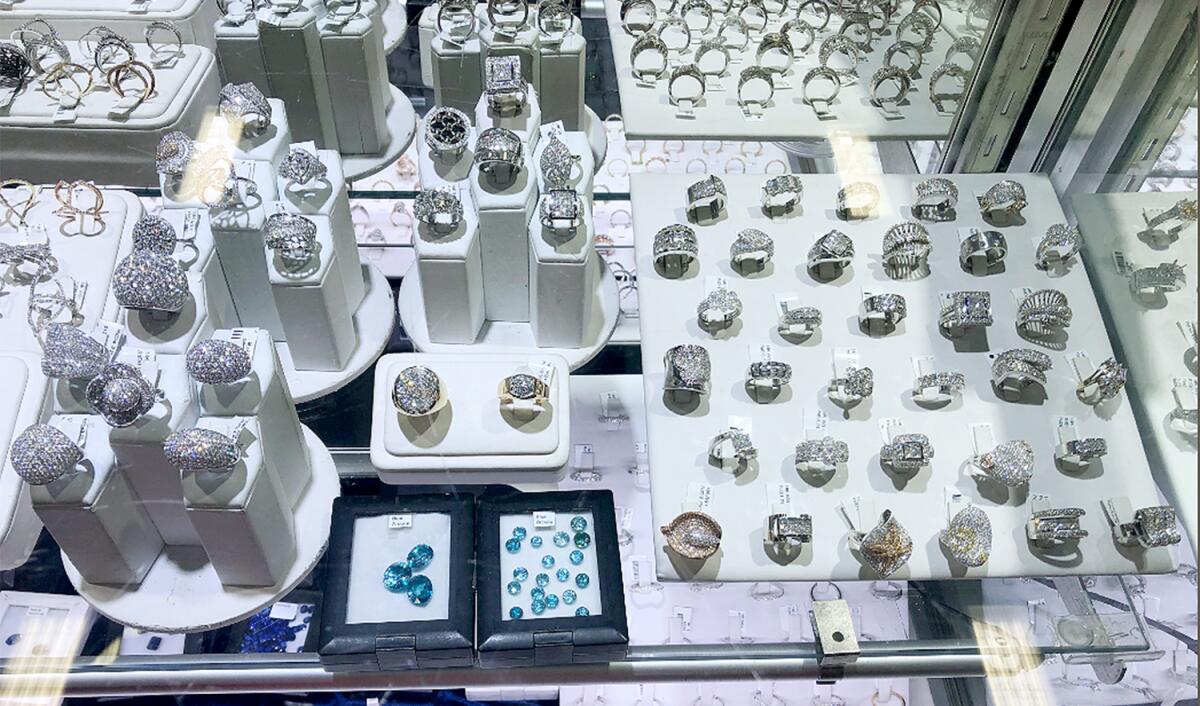 Rings and jewels in a big glass display case.
