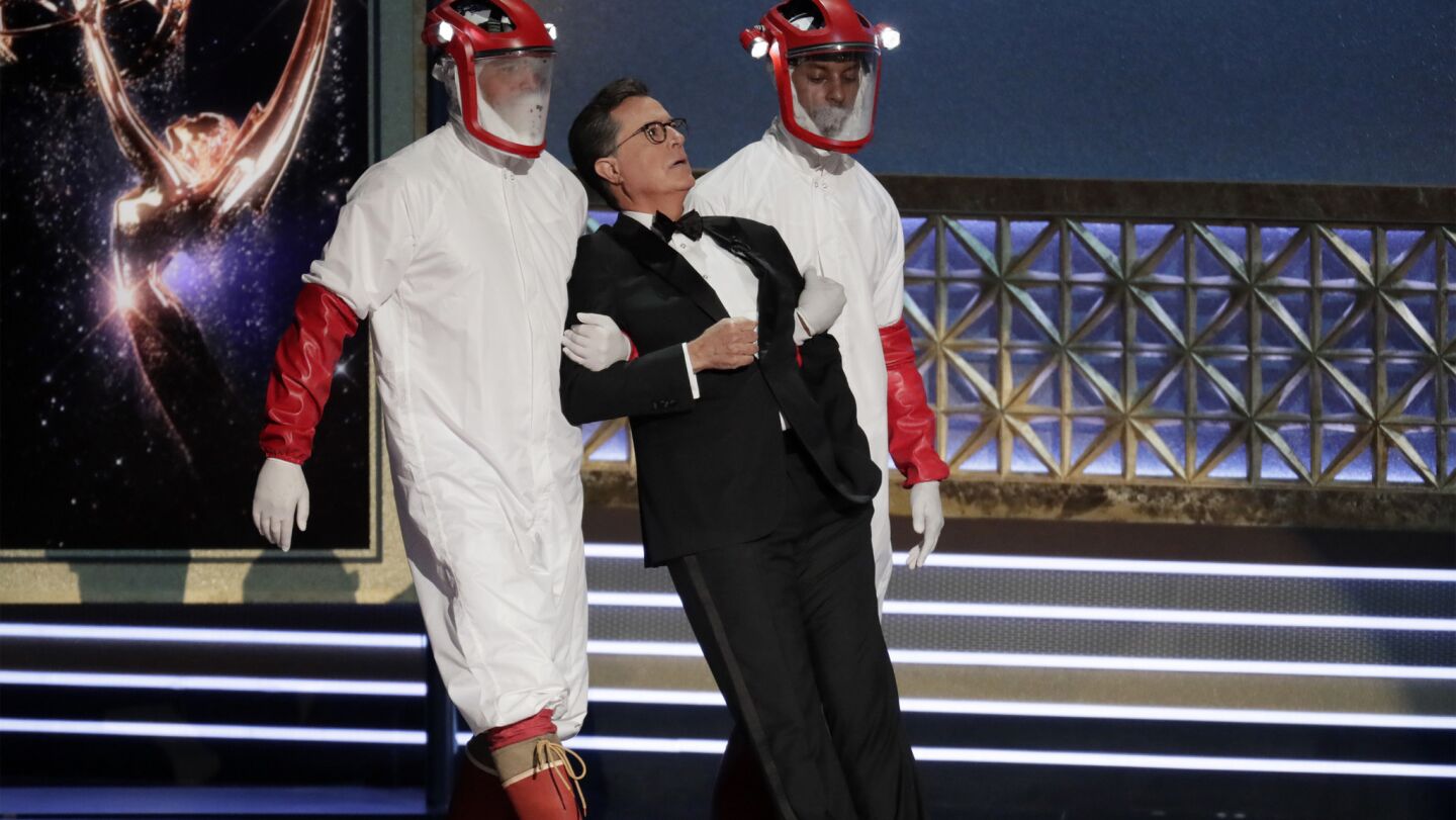 Host Stephen Colbert being carried offstage in a scripted performance.
