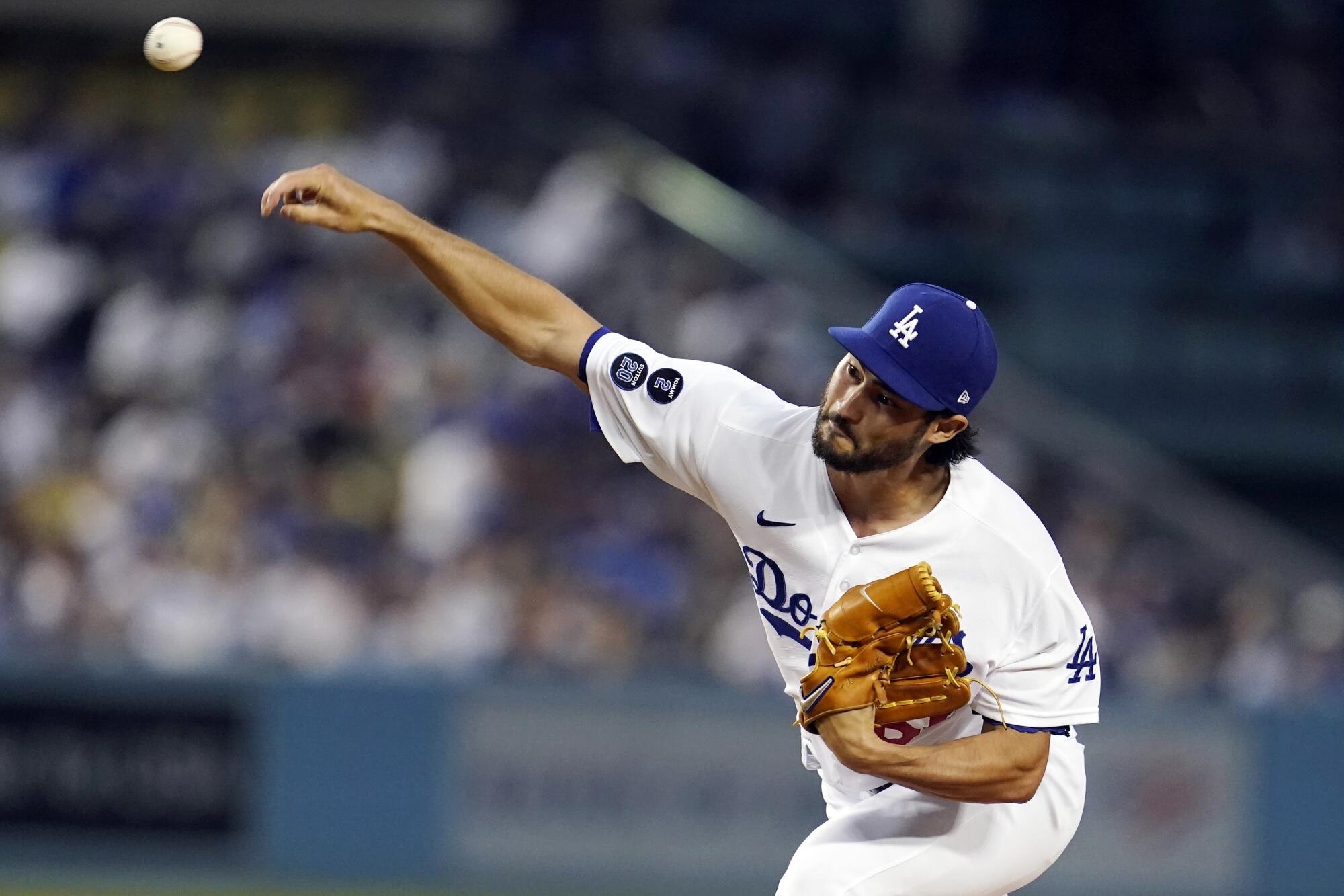 Los Angeles Dodgers relief pitcher Mitch White throws to a Pittsburgh Pirates batter during the second inning.