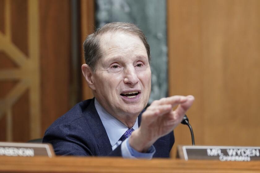 Sen. Ron Wyden, D-Ore., asks a question during the Senate Finance Committee hearing.