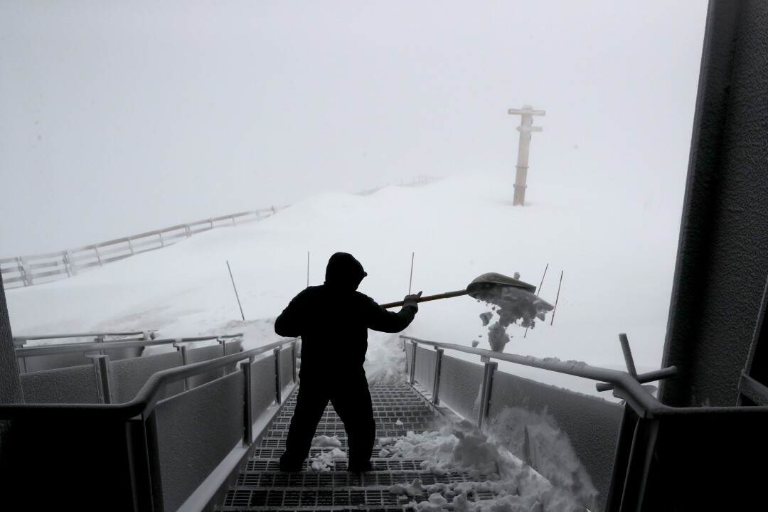Vincent Valencia shovels snow