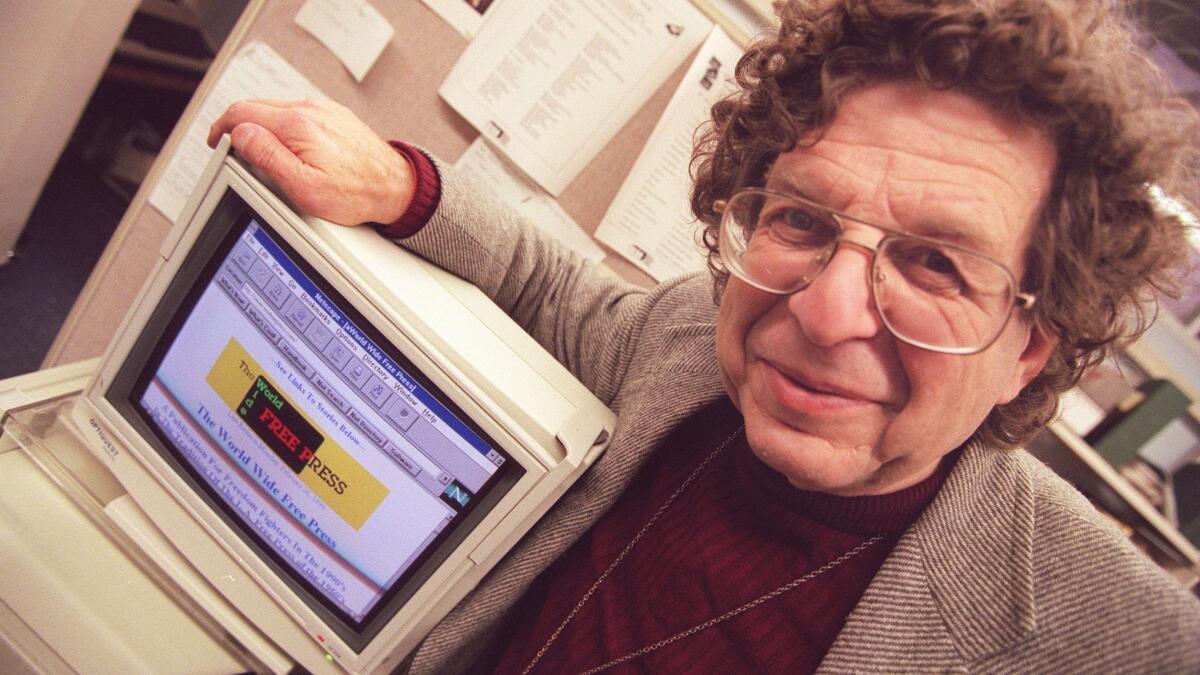 Art Kunkin stands next to a computer with his World Wide Free Press home page in an undated photo. Kunkin was the founder of the L.A. Free Press, a hub for the counterculture movement in the 1960s.