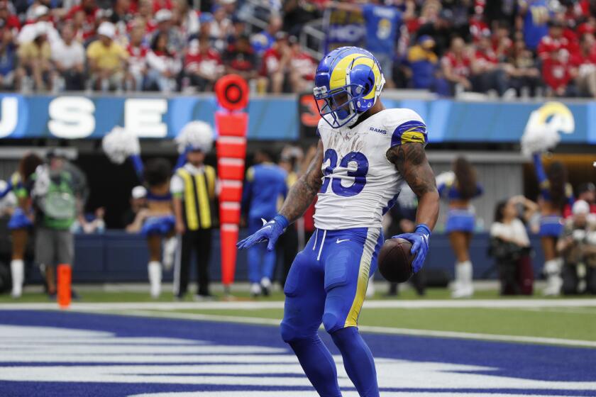  Rams running back Kyren Williams (23) does an end zone dance after scoring against the 49ers.