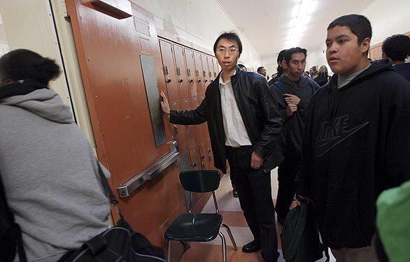 Teacher Zhao Yan Feng, who's on a two-year assignment from China to teach Mandarin at Dorsey High School in South Los Angeles, opens his classroom to his 8 a.m. class. Test scores at the campus are well below state and national average, two-thirds of students live near the poverty line and most have had little exposure to Chinese culture.