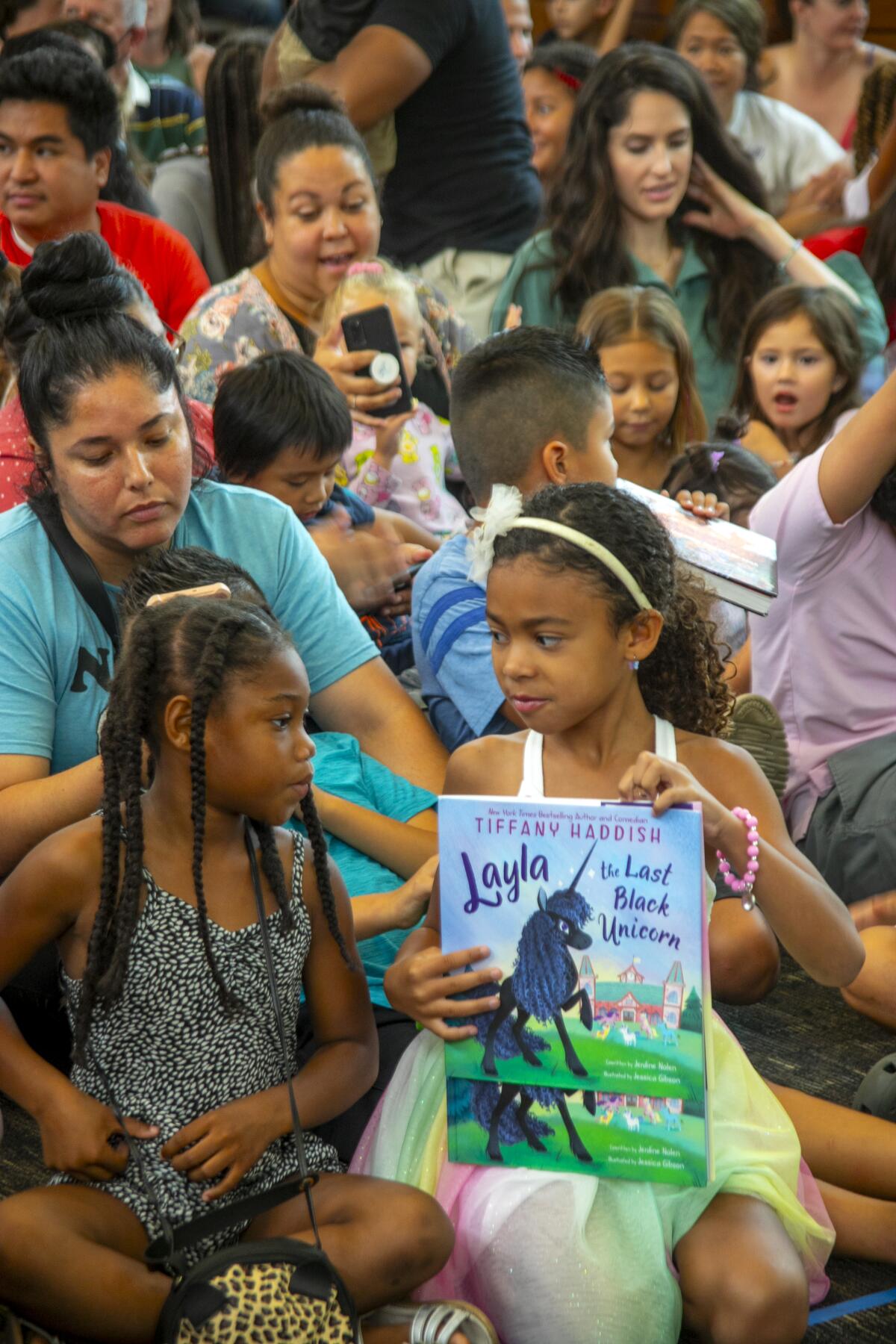 Fans gather at the Tustin Library to meet the author of "Layla, the Last Black Unicorn."