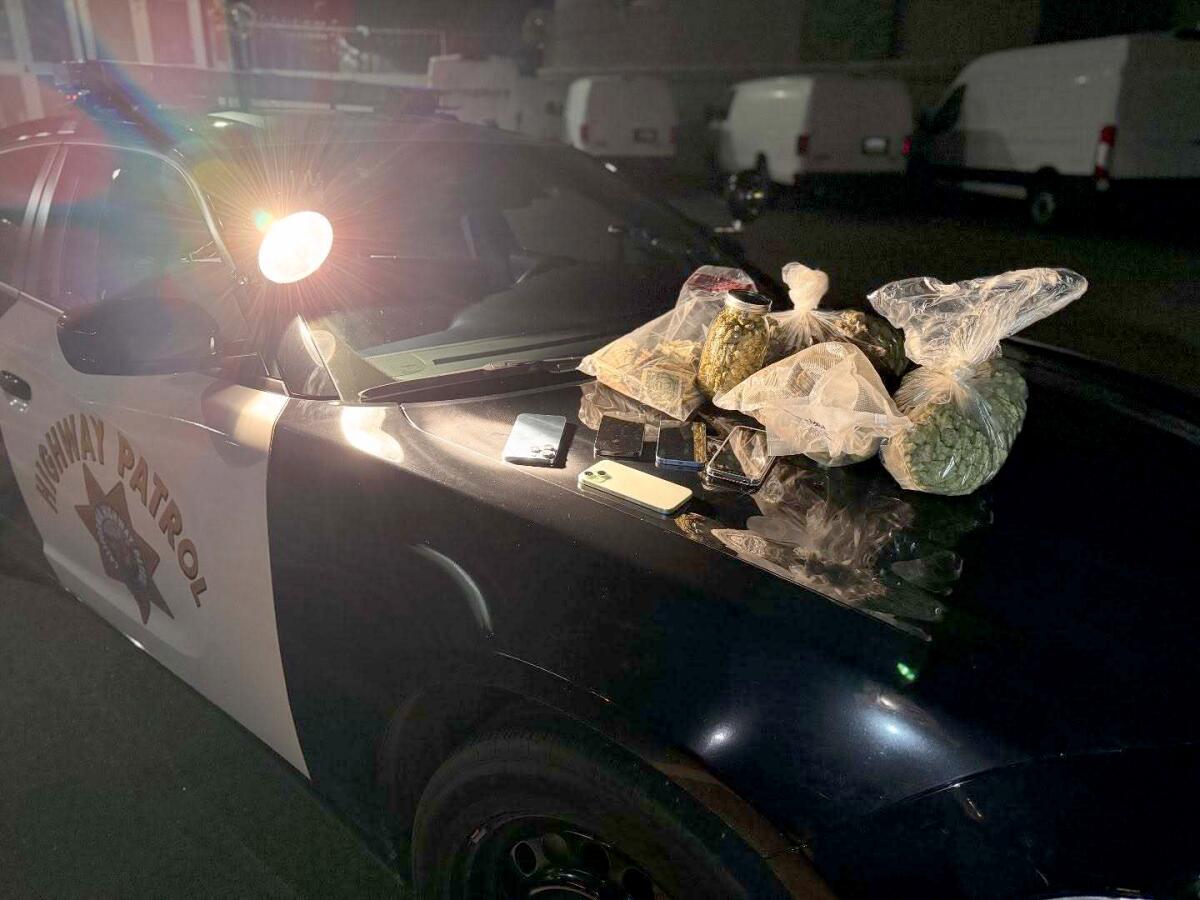 Bags on the hood of a CHP vehicle.