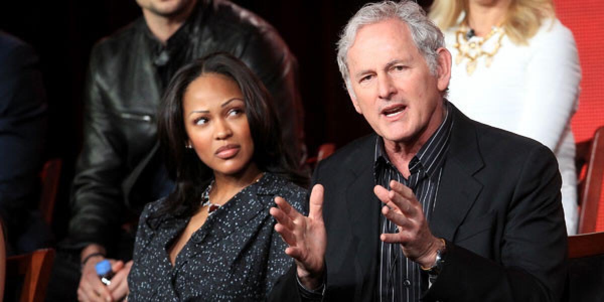 Actors Meagan Good (L) and Victor Garber speak onstage at the "Deception" panel session.