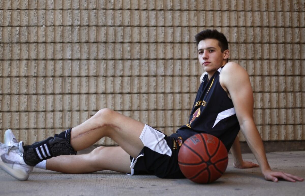 Torrey Pines’ Nick Herrmann, who has a 16-inch scar on his left leg, is shining once again on the basketball courts.