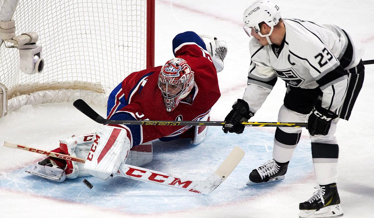 Canadiens goaltender Carey Price stops a shot by the Kings as captain Dustin Brown looks for the rebound in the second period Friday night in Montreal.