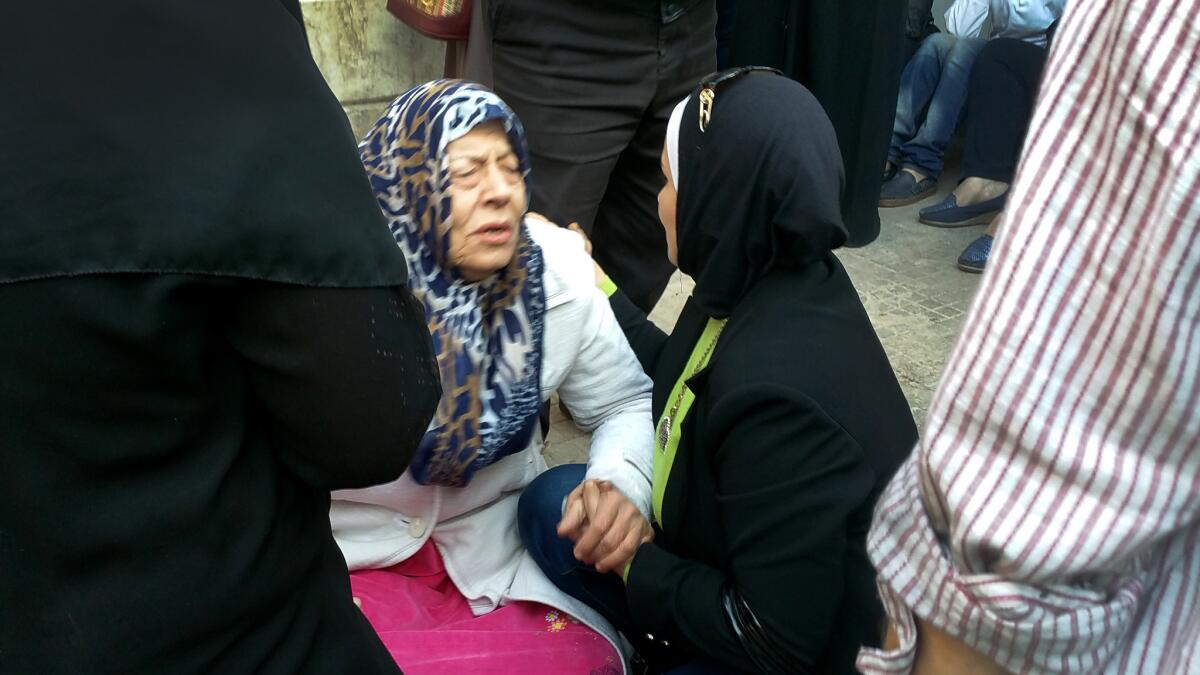 The mother of Ayman Shehadeh grieves for her son was killed in a mortar attack Thursday in Aleppo.