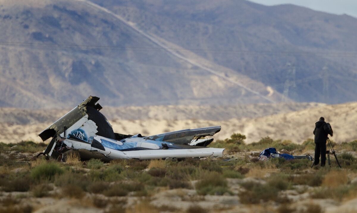 An investigator surveys the scene at the wreckage site of the Virgin Galactic Spaceship Two after it crashed Oct. 31 in the Mojave Desert.